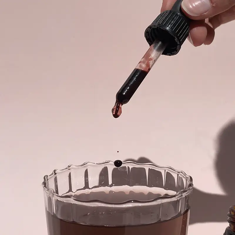 Gif of Draining Drops elixir drops poured into a glass